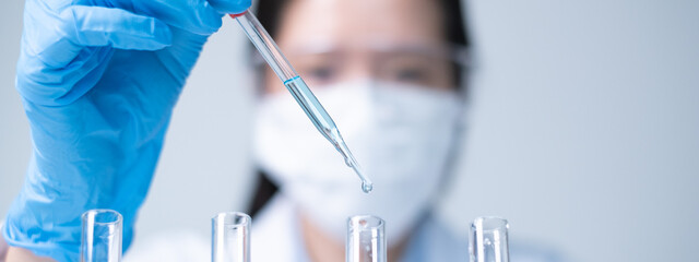 Young Asian woman scientist working science experiment laboratory research chemistry technology innovation data analysis biochemistry concept