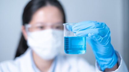 Professional young Asian woman scientist working in laboratory science research experiment...