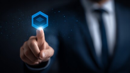 A professional gestures towards a glowing, geometric interface element, symbolizing innovation and digital connection, conveying a sense of control and futuristic technology.