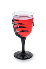 Halloween spooky red cocktail in skeleton hand glass isolated on white background