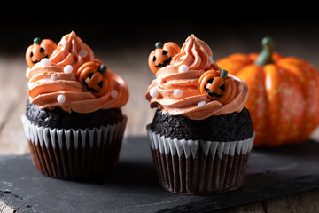 Halloween cupcakes with Halloween sprinkles on dark background