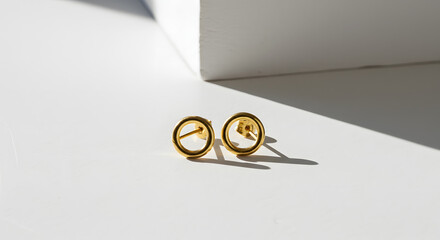 Elegant Minimalist Gold Circle Earrings on a White Surface