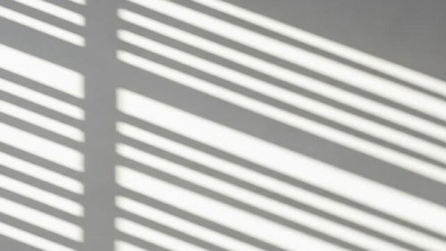 Shadows of Window Blinds on a White Wall, Abstract Light and Lines.