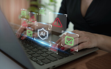 Hands typing on laptop with AI cybersecurity hologram interface showing warning signs and check marks. Concept of artificial intelligence in data protection, online security, and digital safety.