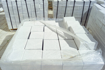 Natural stone bricks as renewable building material. Sustainable paving solution with durability...