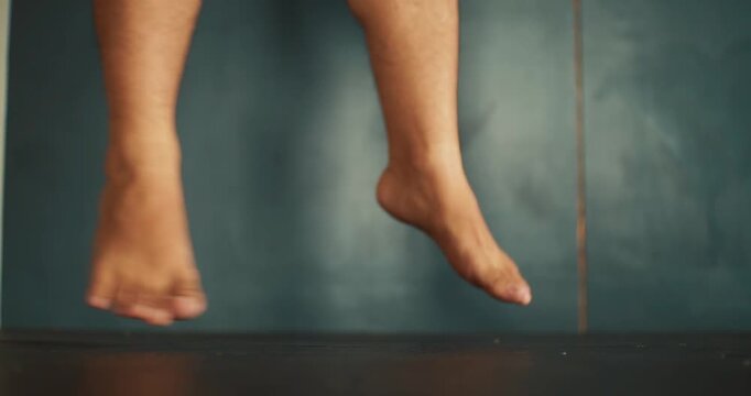 close up bare feet jumping rhythmically on the ground in the fitness gym