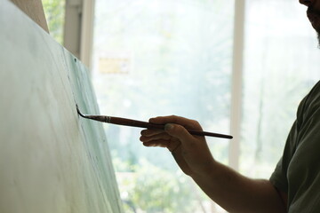 Painting on Canvas in Studio