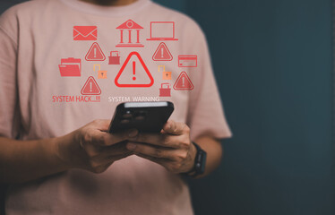 Man using smartphone with digital warning signs about system hack and cybersecurity threats. Concept of online fraud, data breach, internet security, and mobile device safety