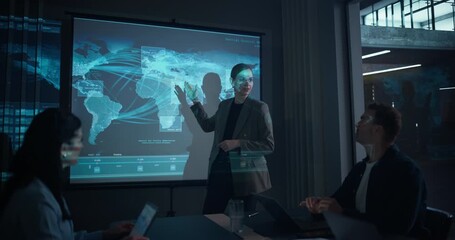 Female Manager Delivers a Corporate Presentation on Global Shipping Technology in an Office Conference Room. She Explains Logistics Innovations to Colleagues, Showing Global Map Visuals on Screen