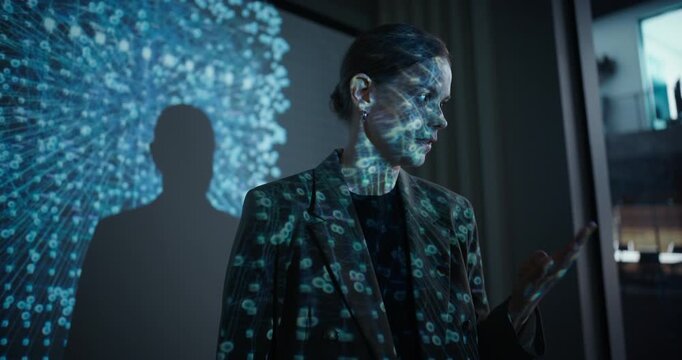 Female Project Leader Presents Advancements in Artificial Intelligence to Her Team During a Company Meeting. She Explains AI Concepts with Slides Featuring Data Science Graphics and Neural Connections