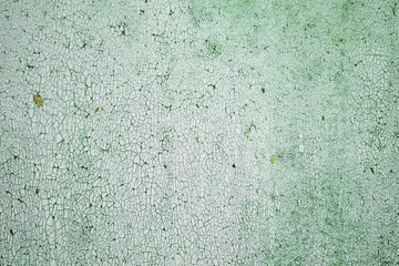 Cracked layers of oil paint as a background for creative works.