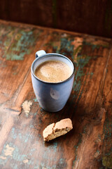 Cup of coffee on rustic wooden background. Soft focus. Copy space	