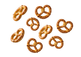 Scattered Golden Mini Pretzels Isolated on White Background. Delicious Crispy Salty Snack Bites, Perfect for Parties and Appetizers.