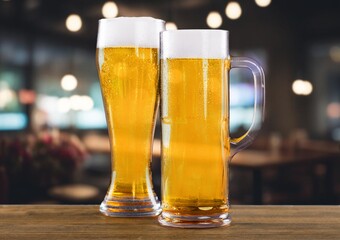 Glass of chilled tasty beer on bar tabletop