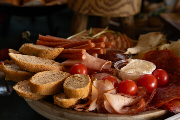 Catering buffet with canape with meat and vegetables on a wooden board. selective focus