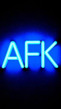 Glowing blue neon afk text on black background in gamer expression style