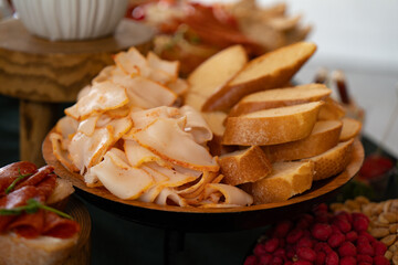 Catering buffet with slised lard variety of food snacks and appetizers.