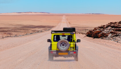 4x4 suv vehicle rides through the sand dune Namib desert - Namibia © muratart
