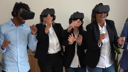 Multiracial business people dancing while using 3d virtual reality headset inside office - Concept of modern technology and metaverse - Powered by Adobe