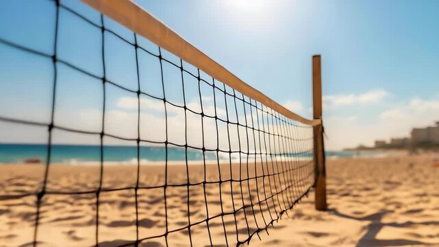 A beach volleyball net on a sunny sandy beach, casting a long shadow toward a wooden post under a bright blue sky.