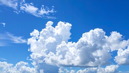 Cumulus clouds against a vibrant blue sky