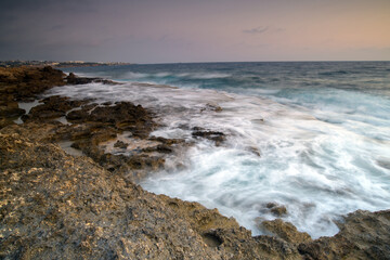 Cyprus Mediterranean Coastline with Turquoise Sea, Sandy Beach, and Clear Blue Sky