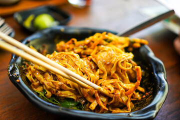 Mixed Khao Soi Noodles in Curry Bowl