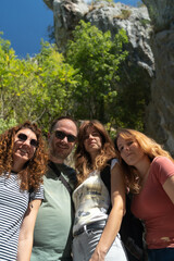 Portrait of a happy group of people in nature outdoors