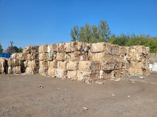 Compression cardboard and paper in a waste paper recycling plant, zero waste concept