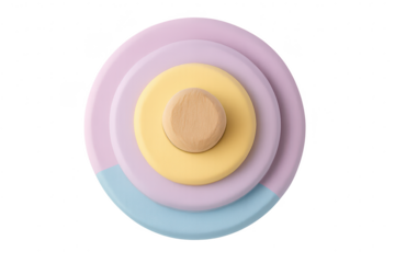 Pastel stacking toy with wooden center, isolated on transparent background.