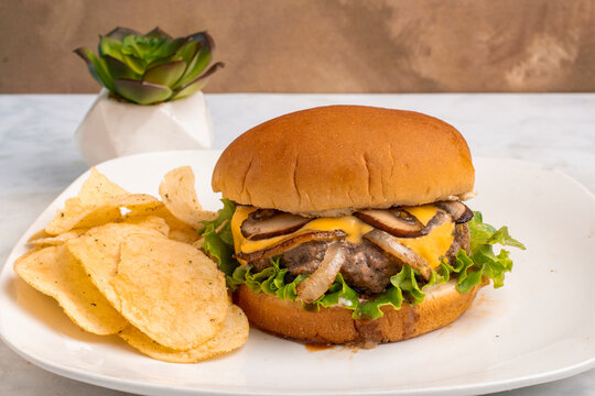 cheese burger top with mushrooms and onios