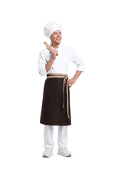 Professional chef in uniform with rolling pin on white background