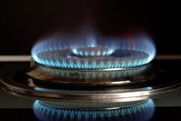 Gas stove is turned on. Closeup view of burning flame