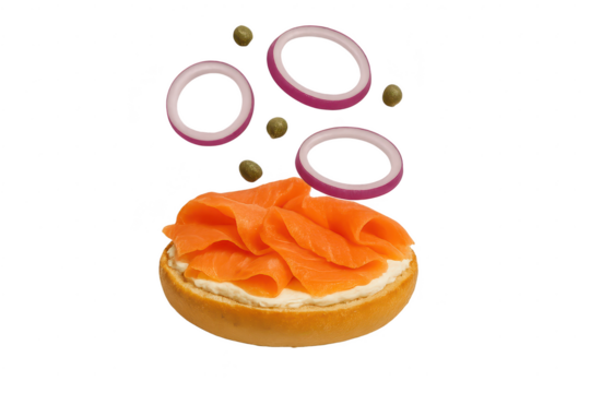 Smoked salmon bagel with cream cheese, red onion and capers, isolated.