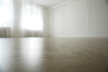 Parquet floor in light spacious empty room