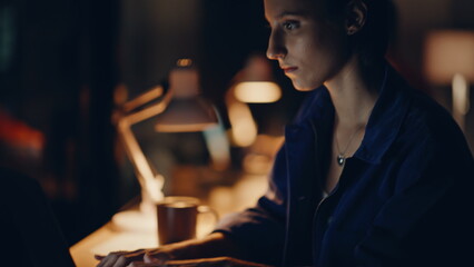 Focused entrepreneurs overtime work in dark coworking closeup. Two programmers
