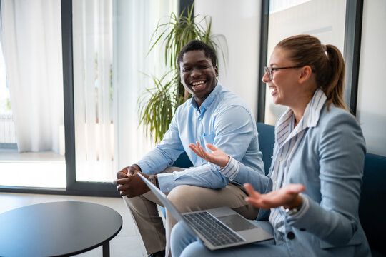 Business colleagues sharing ideas during meeting conversation
