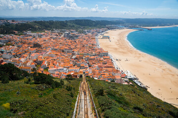 Panoramic View of Nazare Coastal Town with Red Rooftops and Atlantic Ocean in Portugal