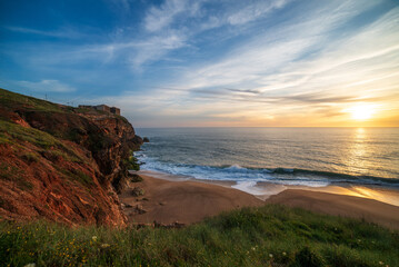 Golden Sunset Over Atlantic Waves on the Sandy Beach of Nazare, Portugal Coastline