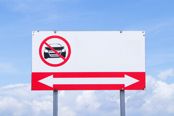 Prohibition sign for car side street all along or no allowed to run. Rules for road users. Drive at safe speed please be careful. Road sign restricts freedom by blue sky cloud white is background.