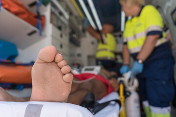 Emergency medical team providing first aid inside ambulance © Jorge
