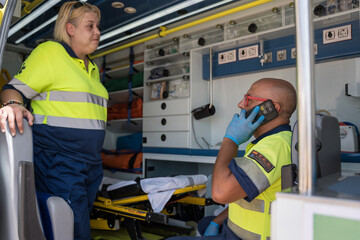 Paramedics preparing for an emergency inside the ambulance © Jorge