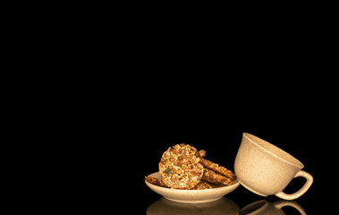 Thaler cookies with nuts and honey isolated on black background, close-up.