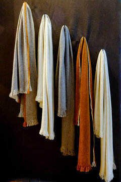 Paris, France.  Europe.  Beautiful, soft cashmere blankets hanging on a wall.