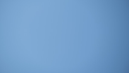 Obraz premium Minimalistic plain blue background with smooth surface