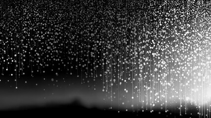 Rainfall of light over a dark landscape at twilight