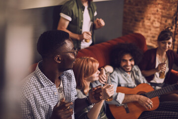 Friends enjoying music and drinks