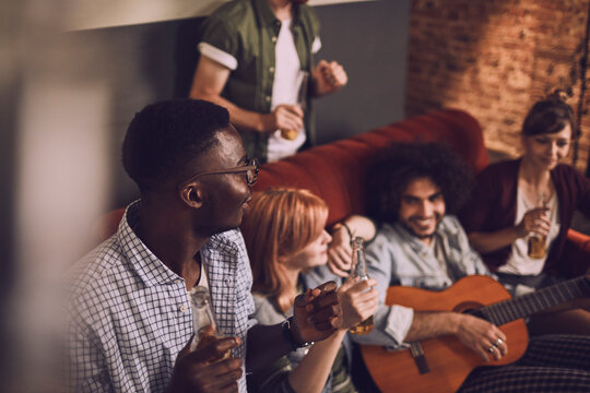 Friends enjoying music and drinks