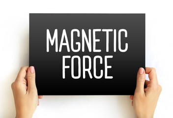 Magnetic Force - attraction or repulsion that arises between electrically charged particles because of their motion, text concept on card