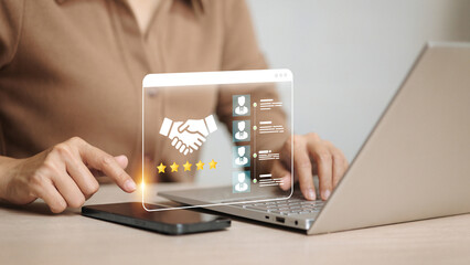Businesswoman Using Virtual Interface with Handshake Icon and Five Star Rating for HR and Partnership